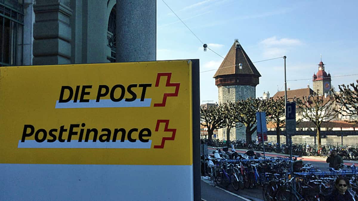PostFinance posts lower half-year profit amid revenue decline