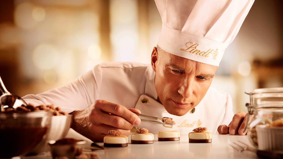 Lindt & Sprüngli cuts costs with ski weekend cancellation, hiring freeze