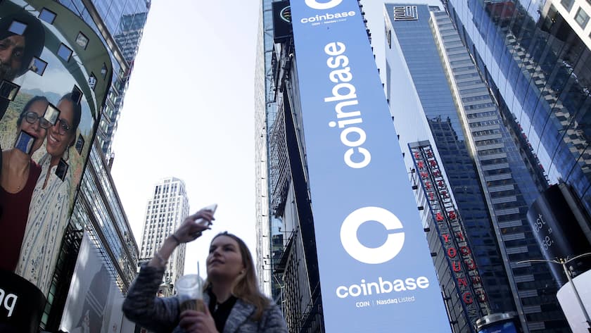 The Coinbase logo is displayed on screens in Times Square when Coinbase Global, Inc. beings trading under the symbol COIN at the Nasdaq Opening Bell in New York City on Wednesday, April 14, 2021. Coinbase runs the largest bitcoin exchange in the U.S. and is the first major cryptocurrency-focused company to go public in the country PUBLICATIONxINxGERxSUIxAUTxHUNxONLY NYP20210414106 JohnxAngelillo