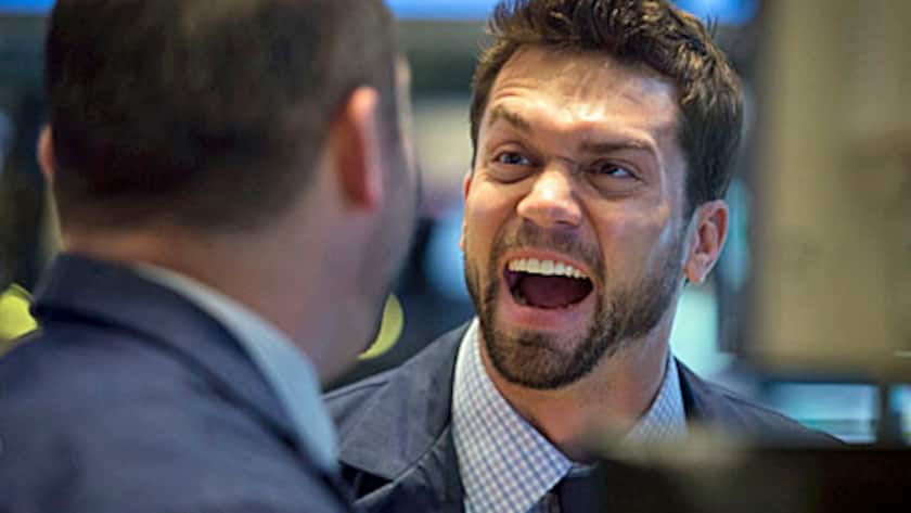 Traders share a laugh at the New York Stock Exchange (NYSE) in New York, U.S., on Tuesday, April 30, 2013.