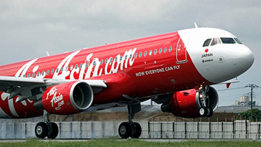 AirAsia Japan Co.'s first Airbus SAS A320 aircraft lands at Narita Airport in Narita City, Chiba Prefecture, Japan, on Monday, June 11, 2012.