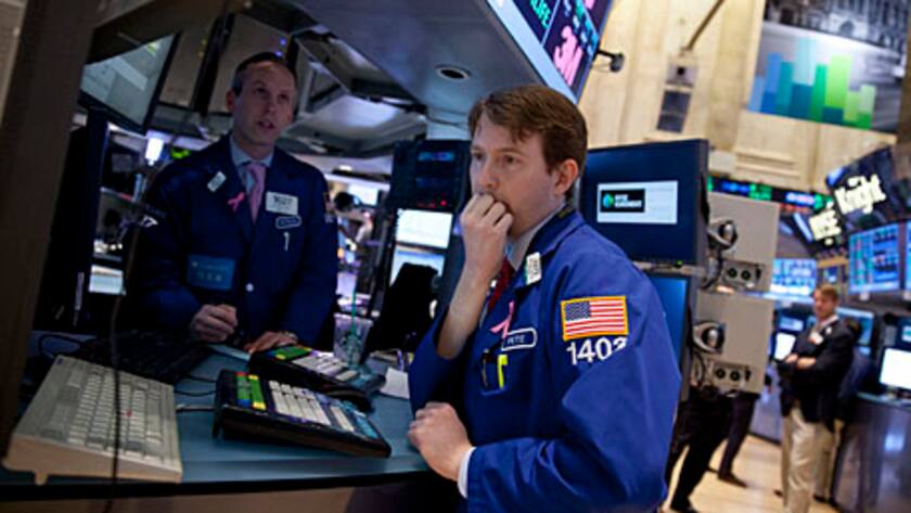 Traders work on the floor of the New York Stock Exchange (NYSE) in New York, U.S., on Tuesday, March 5, 2013.