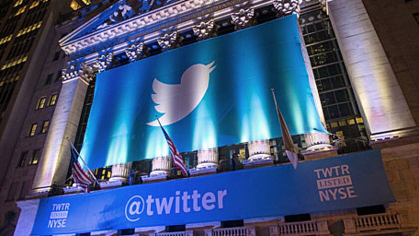 A banner with the Twitter Inc. logo hangs outside the New York Stock Exchange (NYSE) in New York, U.S., on Wednesday, Nov. 6, 2013.