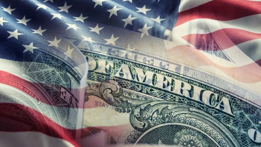 Der Franken profitiert vom Dollar-Verfall American flag and dollar banknotes - business background.