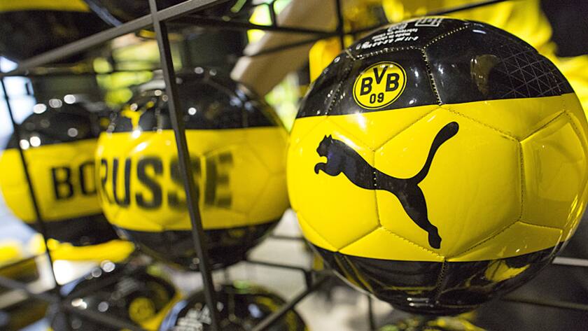 The Puma logo sits on Borussia Dortmund BVB 09 Bundesliga soccer club footballs inside the sportswear company's concept store at the Puma SE headquarters in Herzogenaurach, Germany, on Thursday, Feb. 9, 2017.