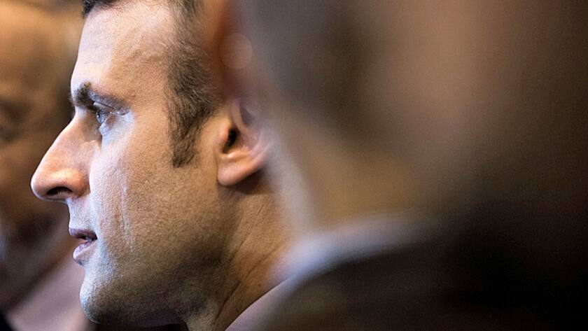 Emmanuel Macron, France's independent presidential candidate, looks on as he visits the Salon du Livre international book fair at the Porte de Versailles exhibition center in Paris, France, on Friday, March 24, 2017.