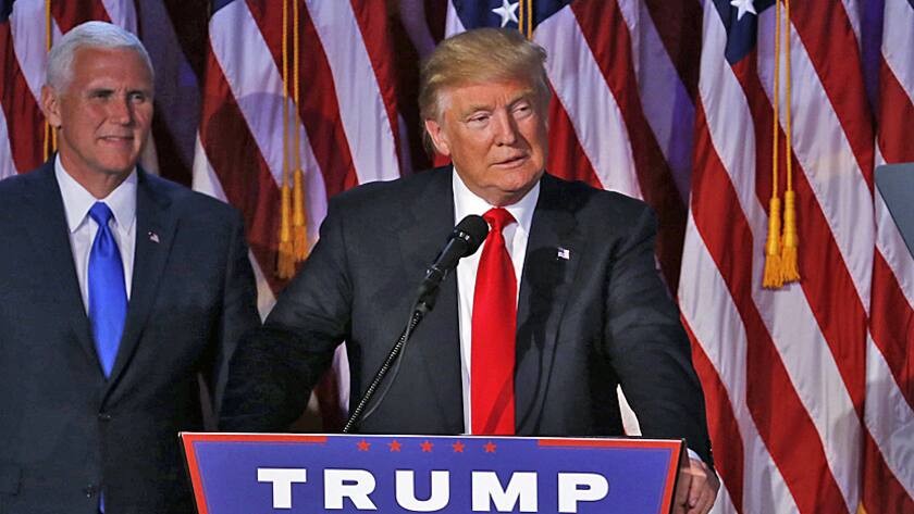 U.S. President-elect Donald Trump, center, speaks an election night party at the Hilton Midtown hotel in New York, U.S., on Wednesday, Nov. 9, 2016.