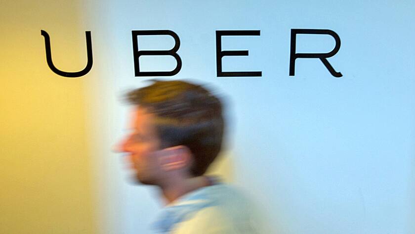 A logo sits on the wall inside the offices of Uber Technologies Inc. at Factory Berlin tech hub in Berlin, Germany, on Monday, May 9th, 2016.