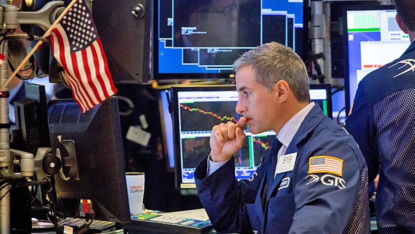 A trader works on the floor of the New York Stock Exchange (NYSE) in New York, U.S., on Monday, Sept. 12, 2016.