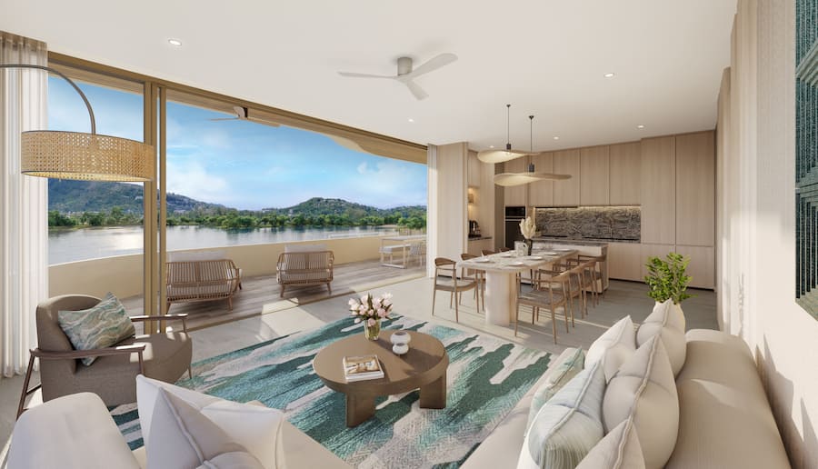 Wohnzimmer in einem Apartment mit drei Schlafzimmern von Banyan Group Residences in Bang Tao, Phuket, Thailand.